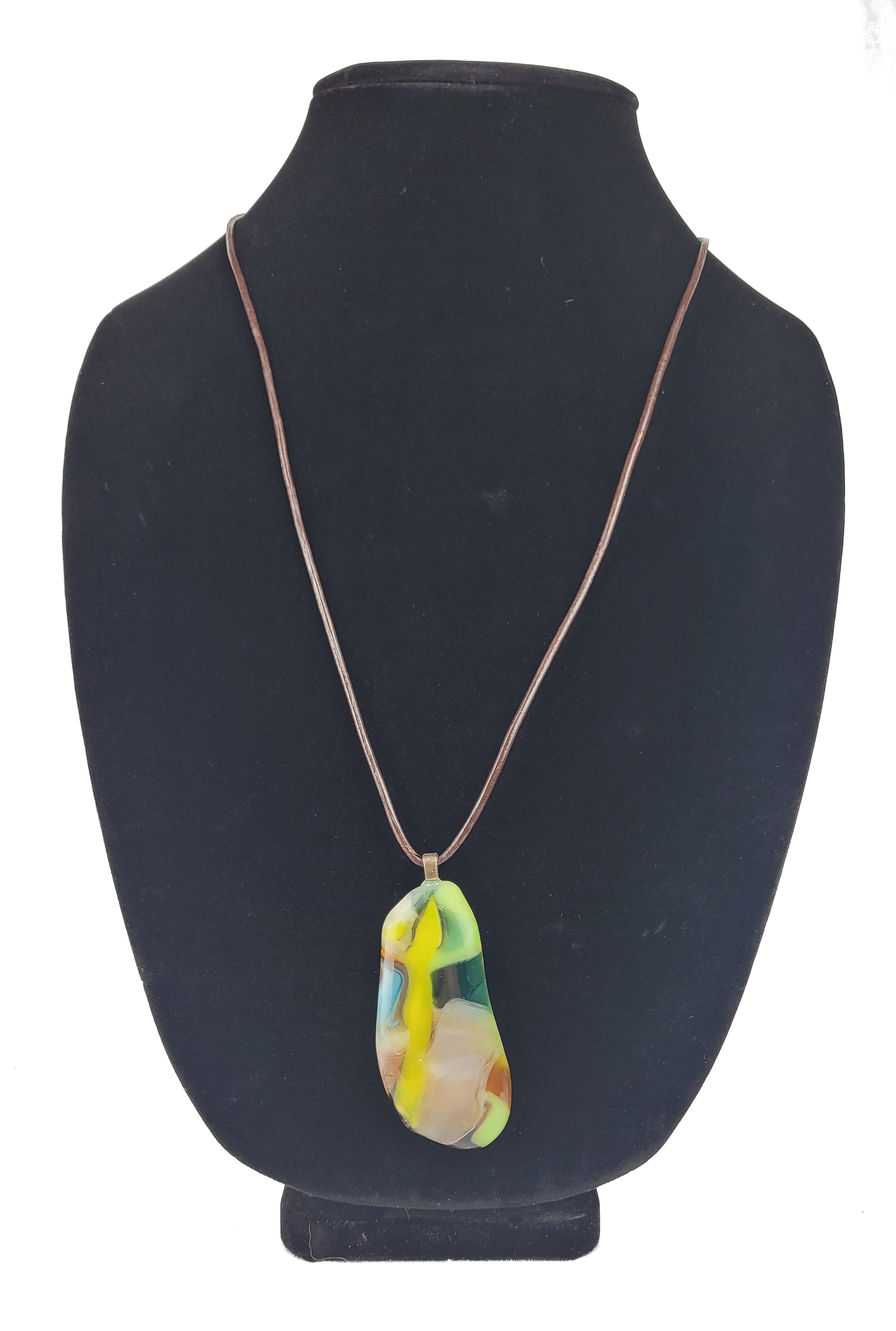 Necklace with a colorful pendant on a black mannequin bust
