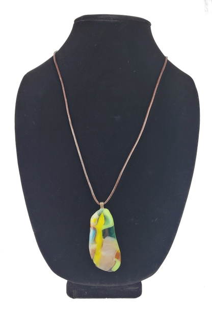 Necklace with a colorful pendant on a black mannequin bust