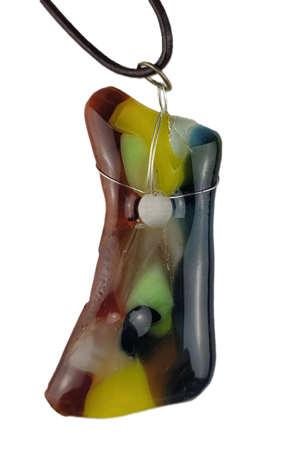 Colorful glass pendant on a cord against a white background