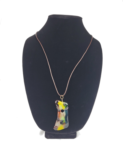 Necklace with a colorful pendant on a black bust against a white background