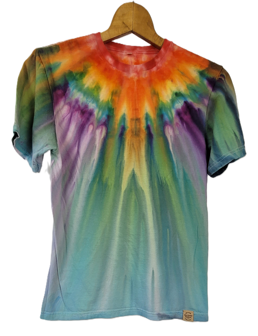 Colorful tie-dye t-shirt on a wooden hanger against a white background