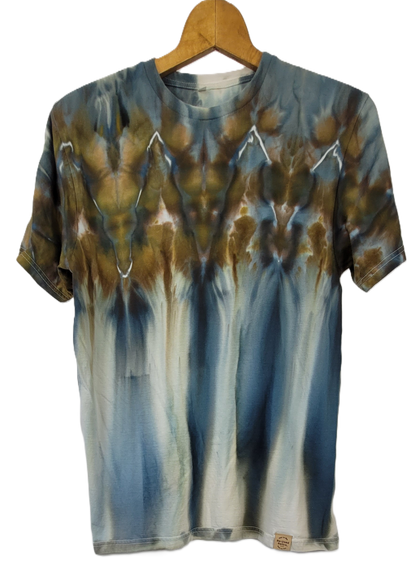Tie-dye t-shirt on a wooden hanger with a white background
