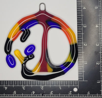 Colorful abstract design on a white background with a ruler for scale.
