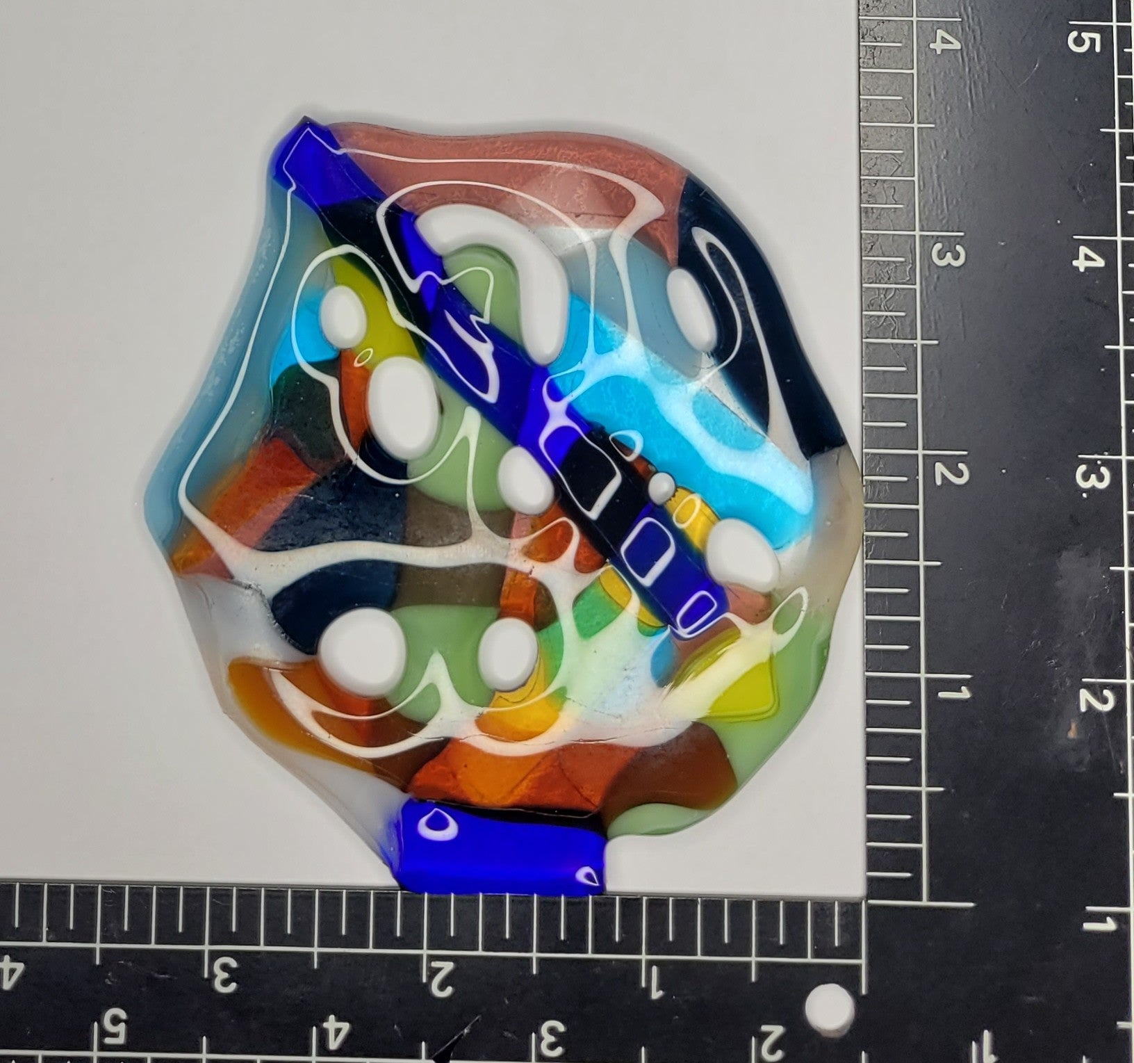 Colorful suncatcher with ruler for scale