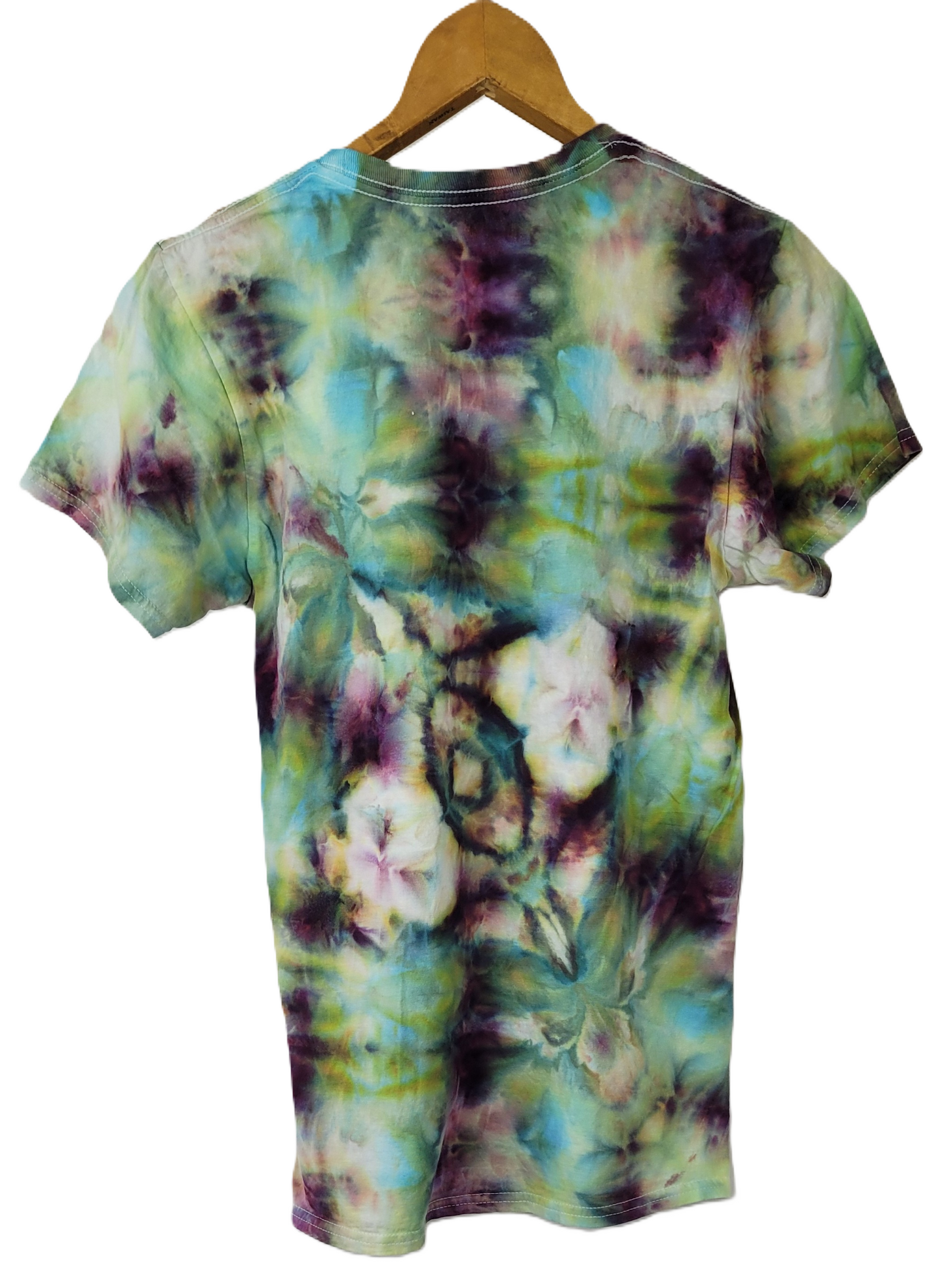 Tie-dye t-shirt on a wooden hanger with a white background