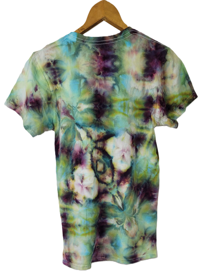 Tie-dye t-shirt on a wooden hanger with a white background