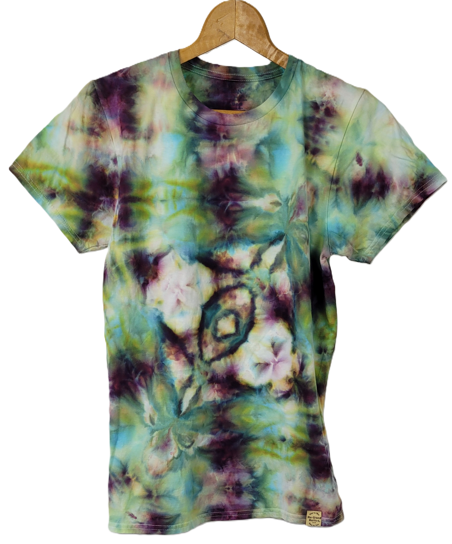 Tie-dye t-shirt with floral pattern on a hanger against a white background