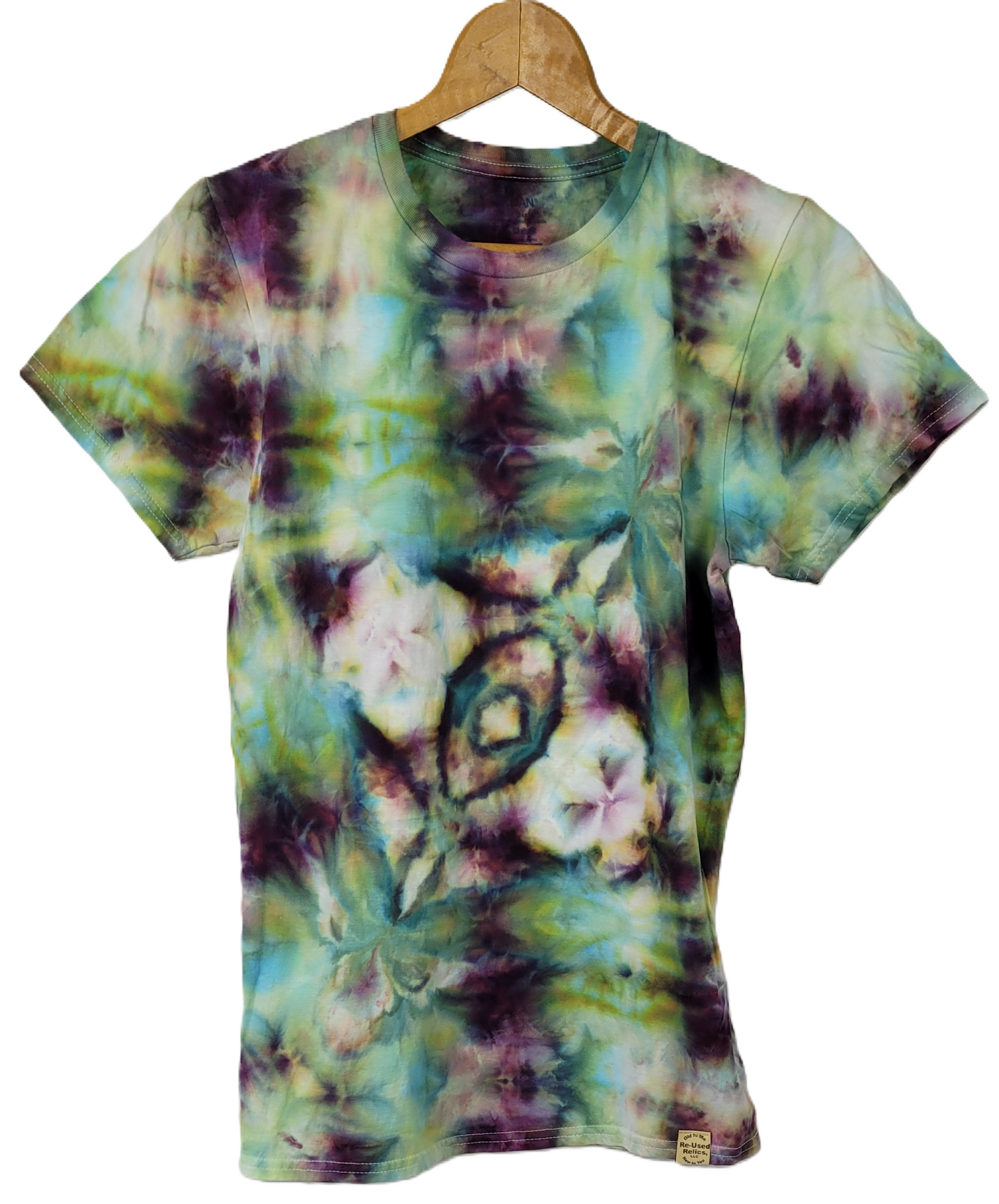 Tie-dye t-shirt with floral pattern on a hanger against a white background