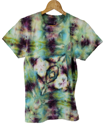Tie-dye t-shirt with floral pattern on a hanger against a white background