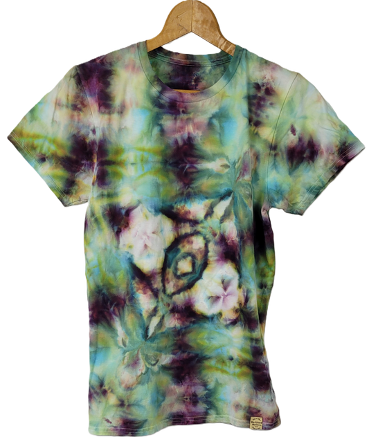 Tie-dye t-shirt with floral pattern on a hanger against a white background