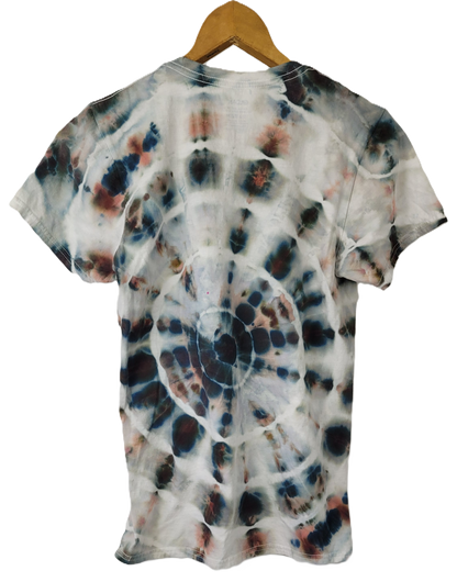 Tie-dye t-shirt on a wooden hanger with a white background