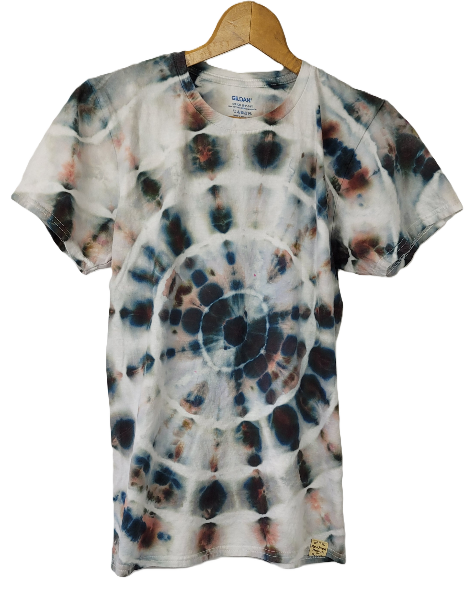 Tie-dye t-shirt on a wooden hanger with a white background