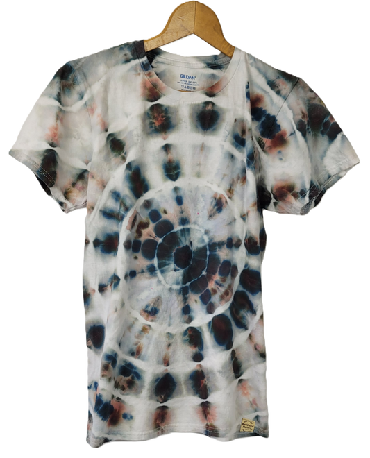 Tie-dye t-shirt on a wooden hanger with a white background