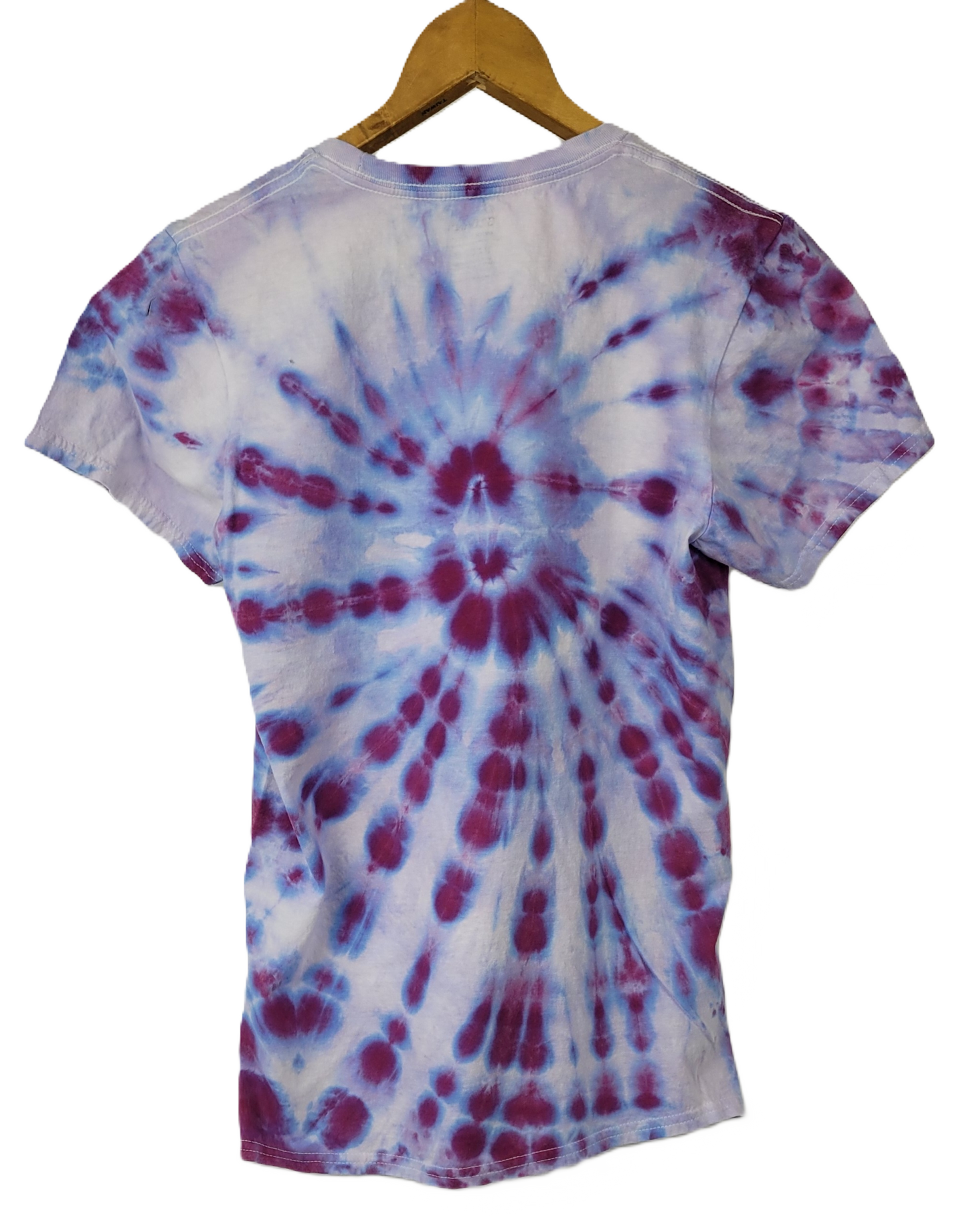Tie-dye t-shirt with a spiral pattern on a hanger against a white background