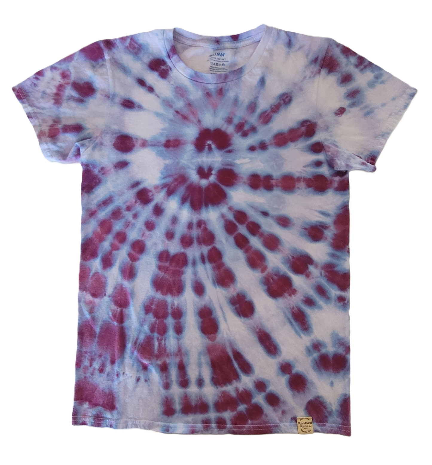 Tie-dye t-shirt with red and blue spiral pattern on a white background