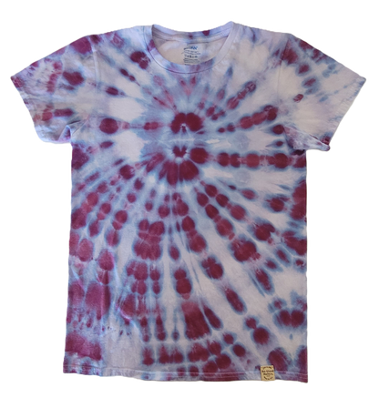 Tie-dye t-shirt with red and blue spiral pattern on a white background