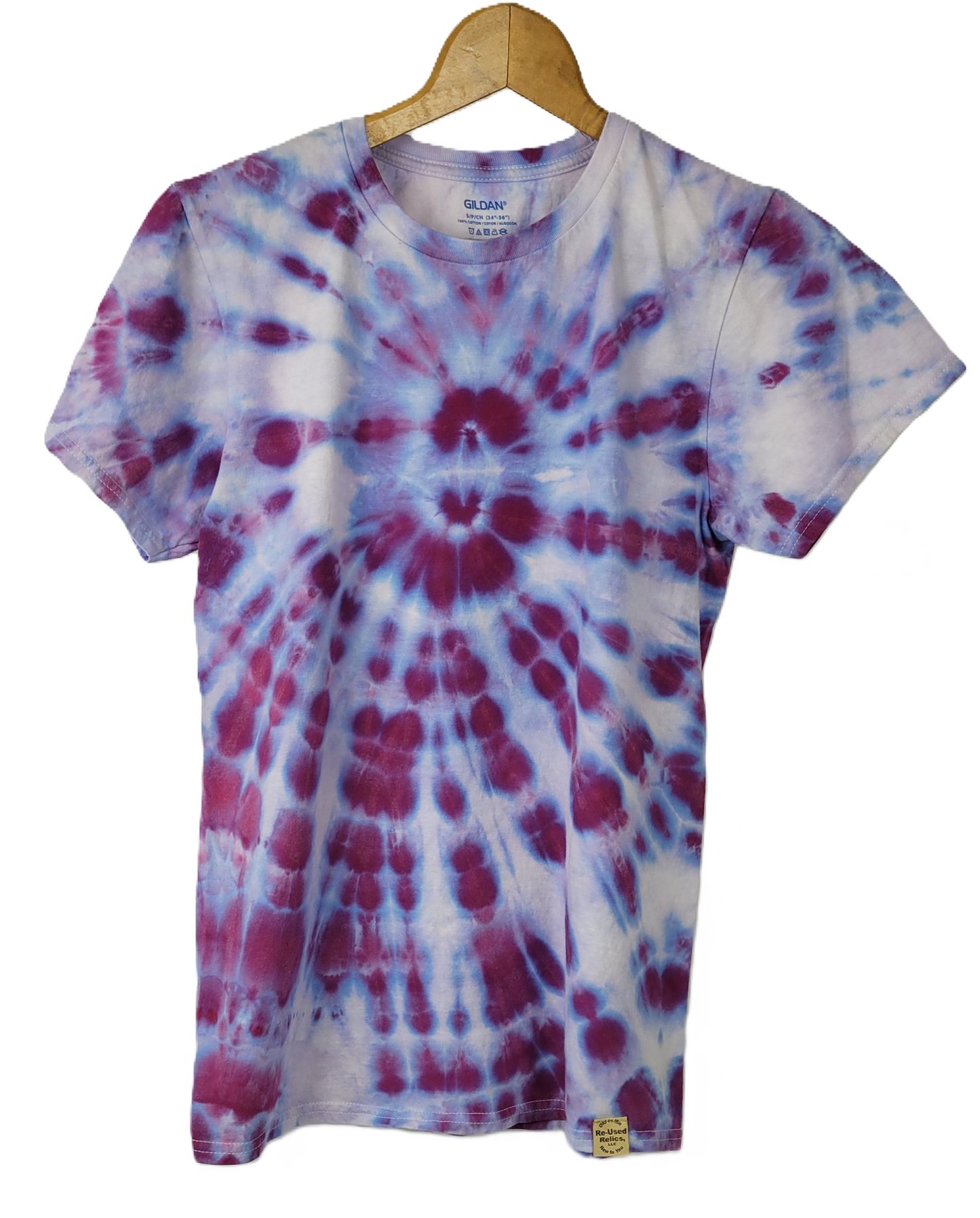 Tie-dye t-shirt with purple and white pattern on a hanger
