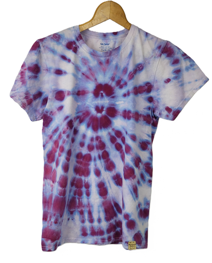 Tie-dye t-shirt with purple and white pattern on a hanger