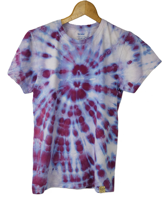 Tie-dye t-shirt with purple and white pattern on a hanger