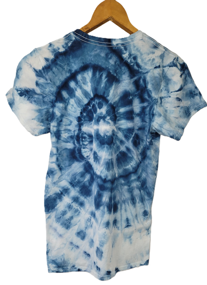 Blue and white tie-dye t-shirt on a wooden hanger against a white background