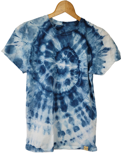 Tie-dye t-shirt with blue and white spiral pattern on a hanger against a white background