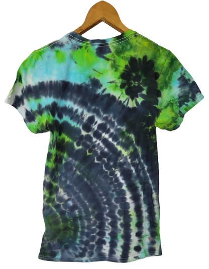 Tie-dye t-shirt with green and blue patterns on a hanger