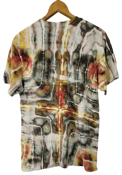 Short-sleeve shirt with abstract multicolor design on a hanger against a white background