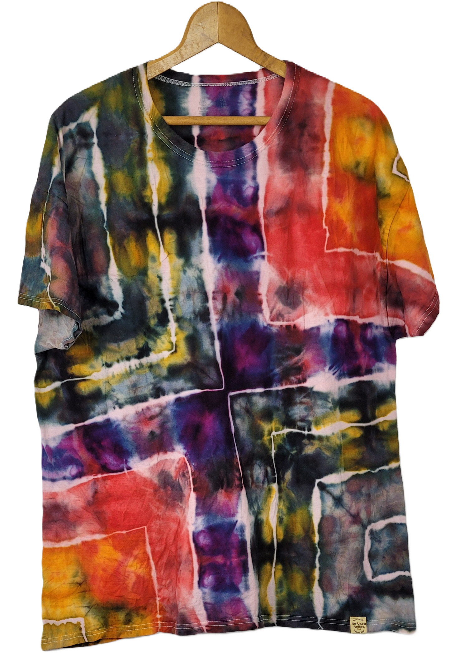 Colorful tie-dye shirt on a hanger against a white background