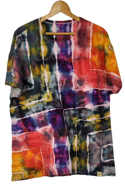 Colorful tie-dye shirt on a hanger against a white background