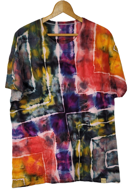 Colorful tie-dye shirt on a hanger against a white background