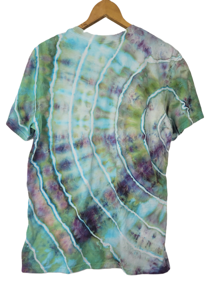 Tie-dye t-shirt with wavy pattern on a hanger
