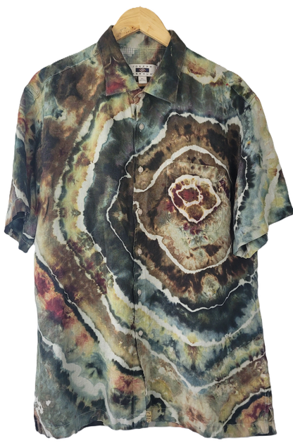 Colorful tie-dye shirt on a hanger with a white background