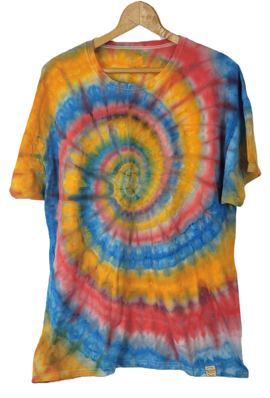 Colorful tie-dye t-shirt on a hanger with a white background