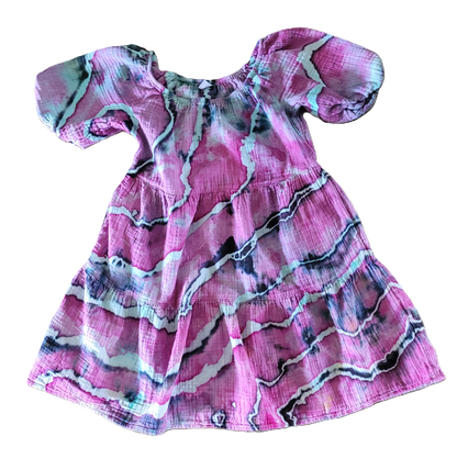 Pink dress with abstract pattern on a white background