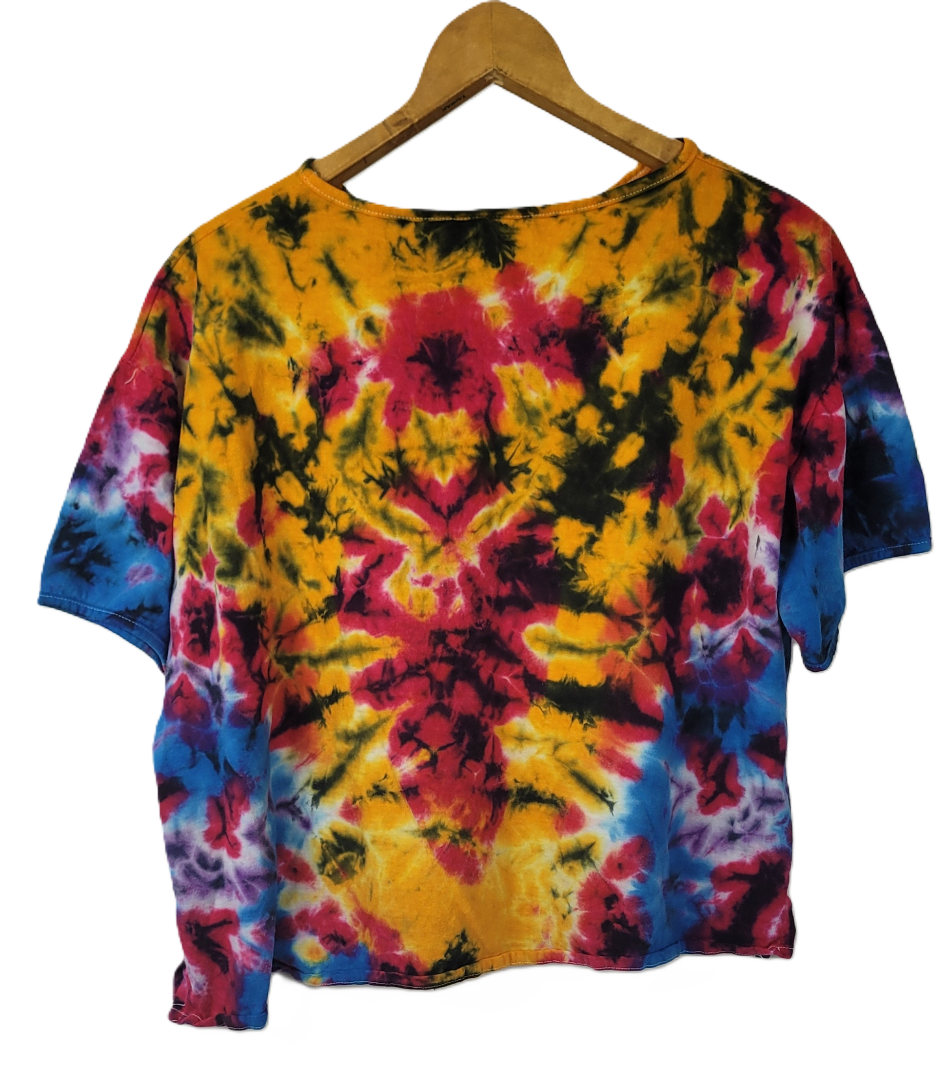 Colorful tie-dye shirt on a wooden hanger against a white background