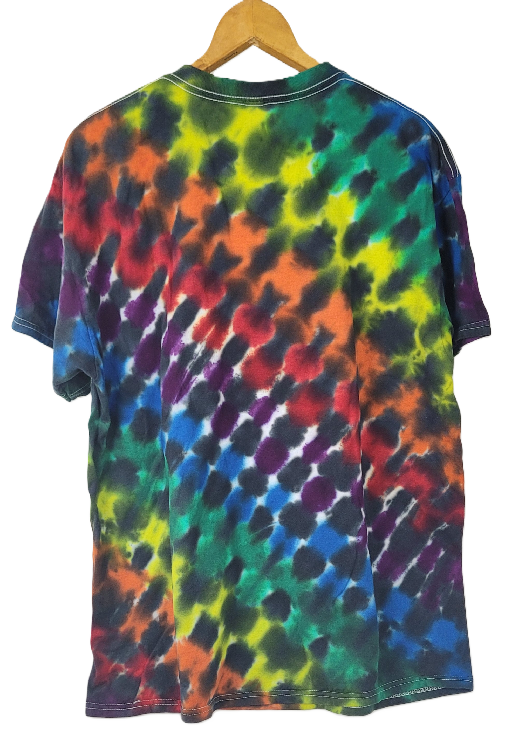 Multicolored tie-dye t-shirt on a wooden hanger with a white background