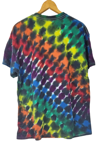 Multicolored tie-dye t-shirt on a wooden hanger with a white background