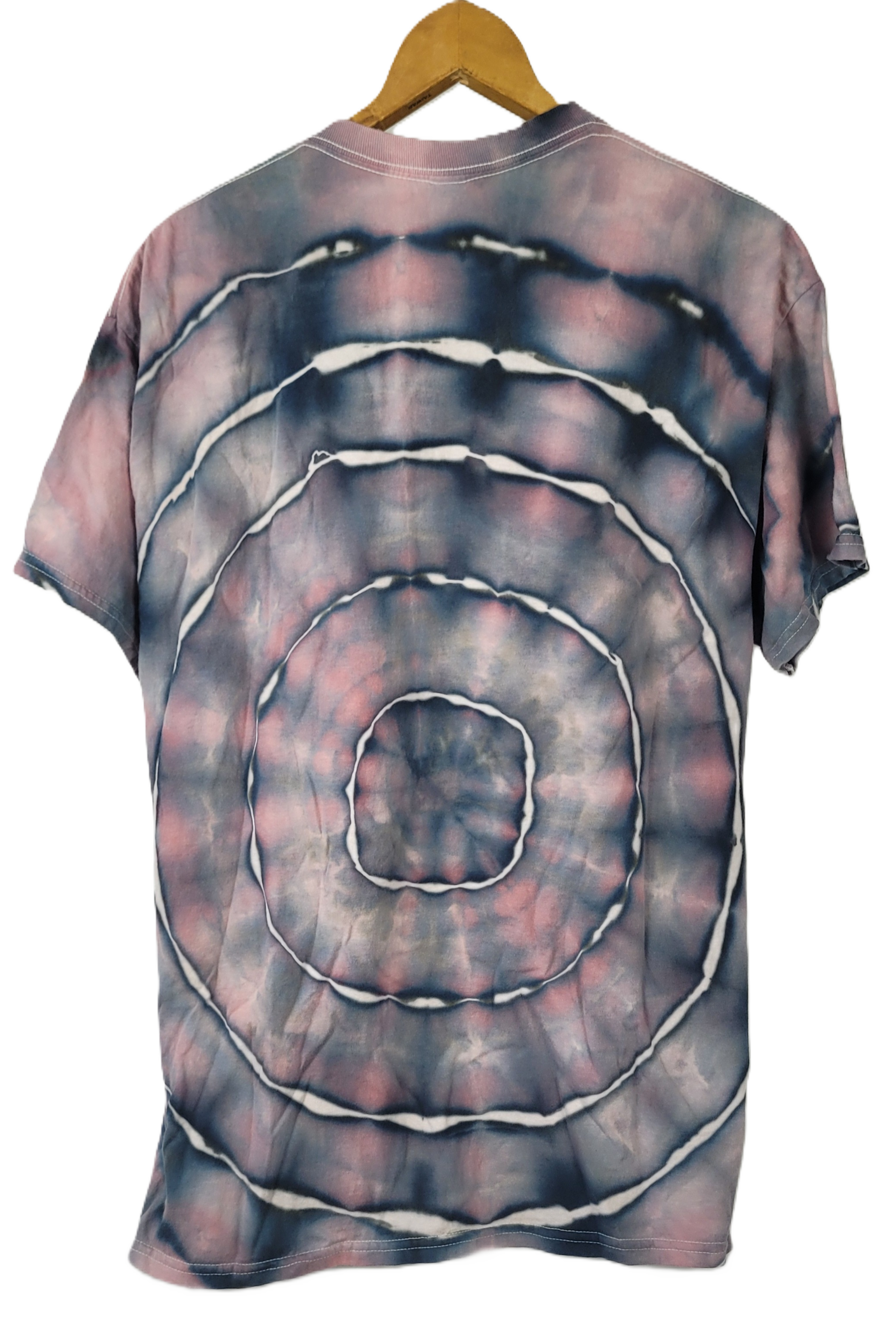 Tie-dye t-shirt with concentric circle pattern on a hanger