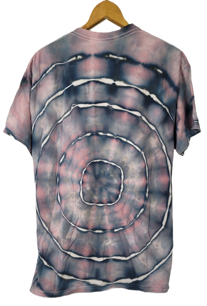 Tie-dye t-shirt with concentric circle pattern on a hanger