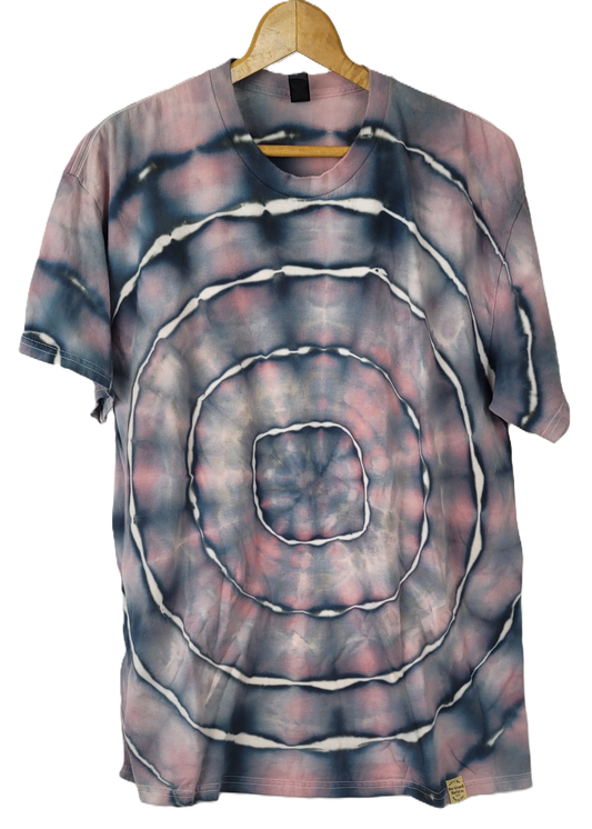 Tie-dye t-shirt with concentric circle pattern on a hanger