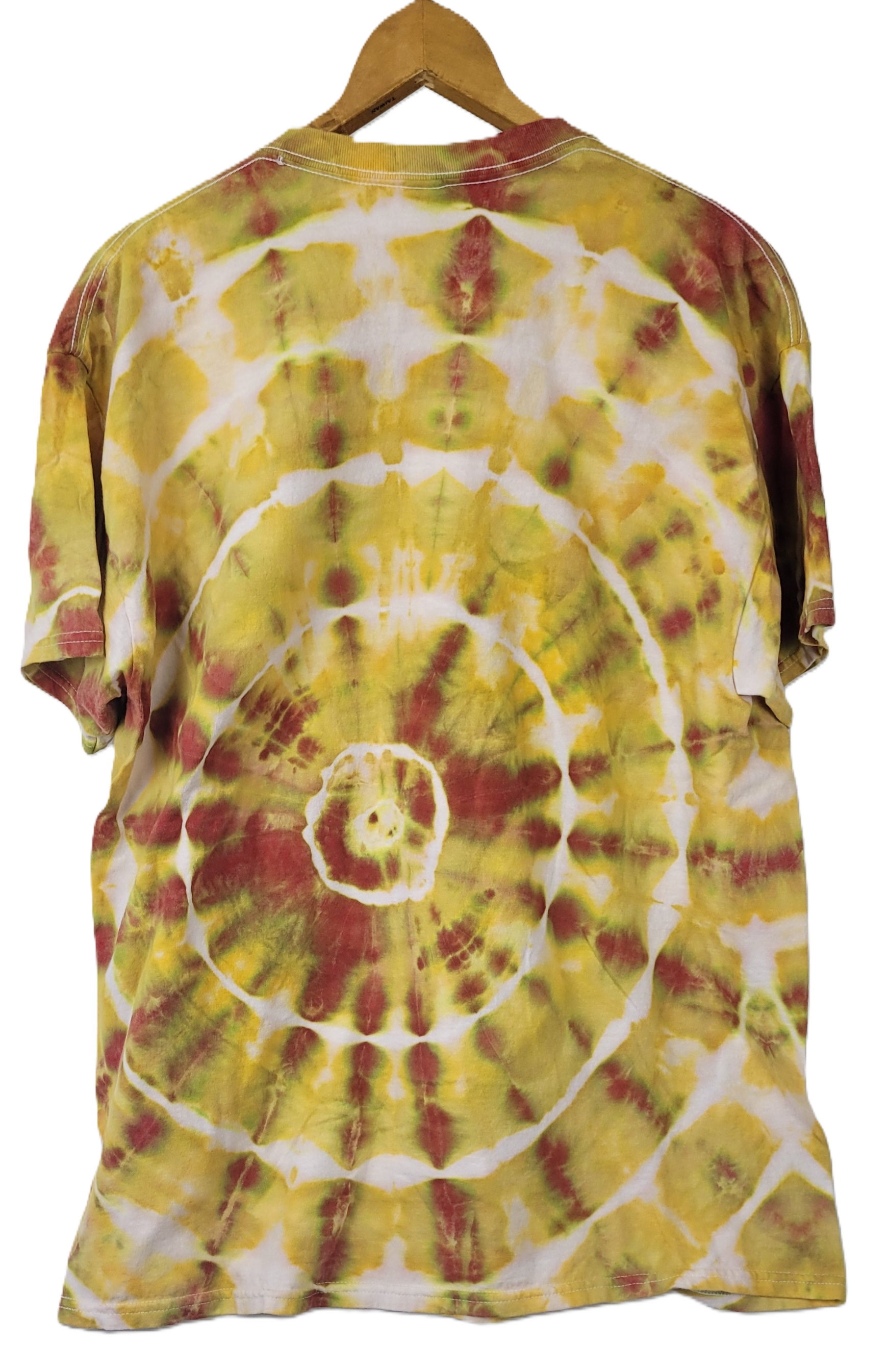 Tie-dye t-shirt with a spiral pattern in yellow, red, and white on a hanger.