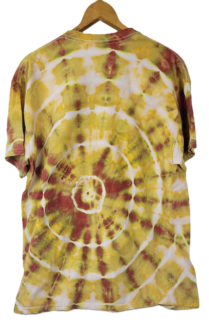 Tie-dye t-shirt with a spiral pattern in yellow, red, and white on a hanger.