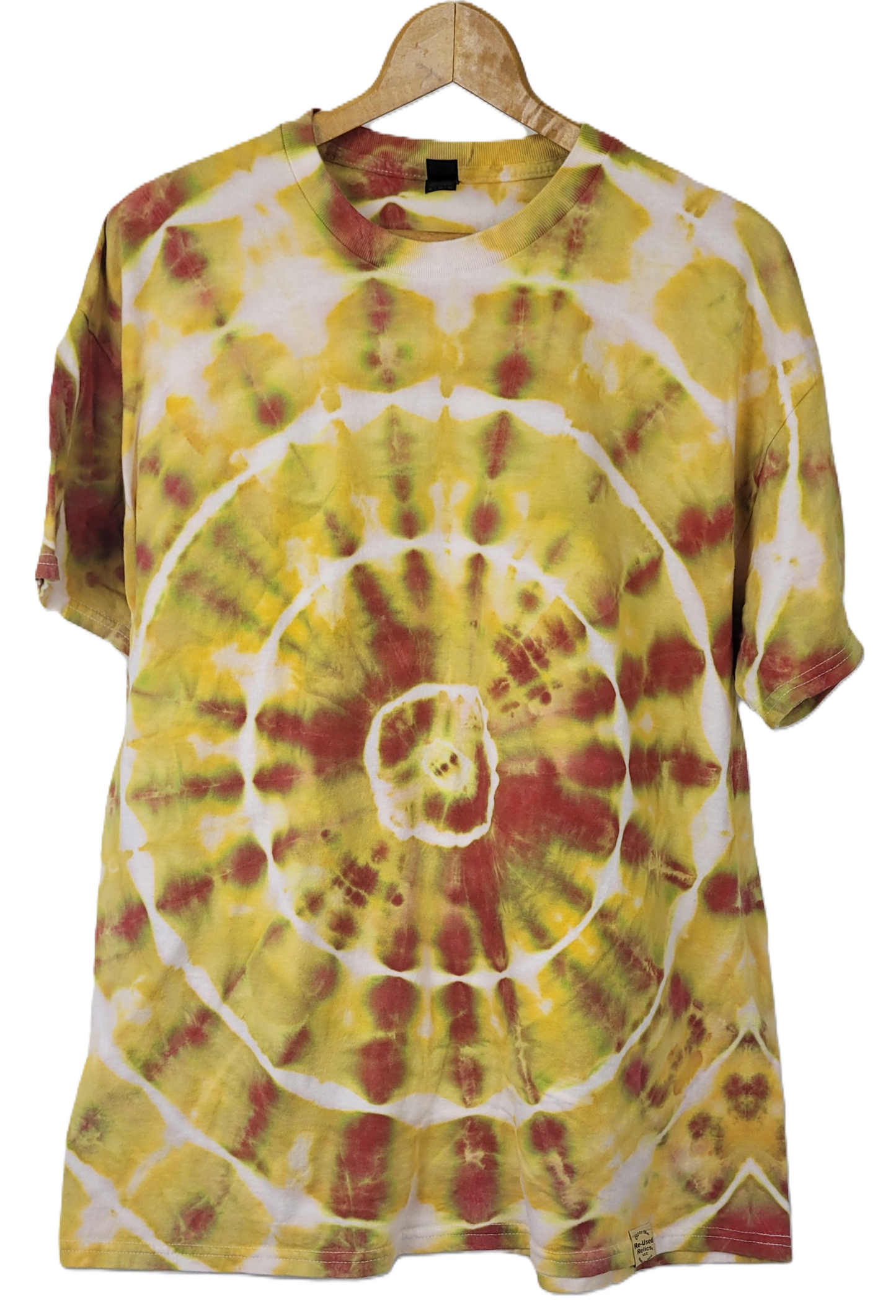 Tie-dye t-shirt with yellow and red spiral pattern on a hanger against a white background