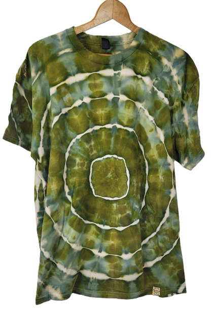 Green and white tie-dye t-shirt on a wooden hanger
