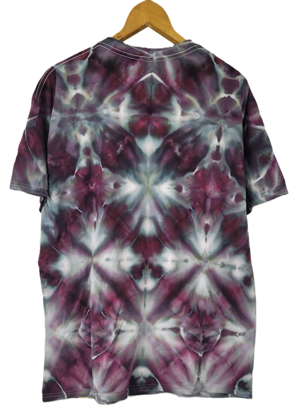 Tie-dye t-shirt with a geometric pattern on a hanger