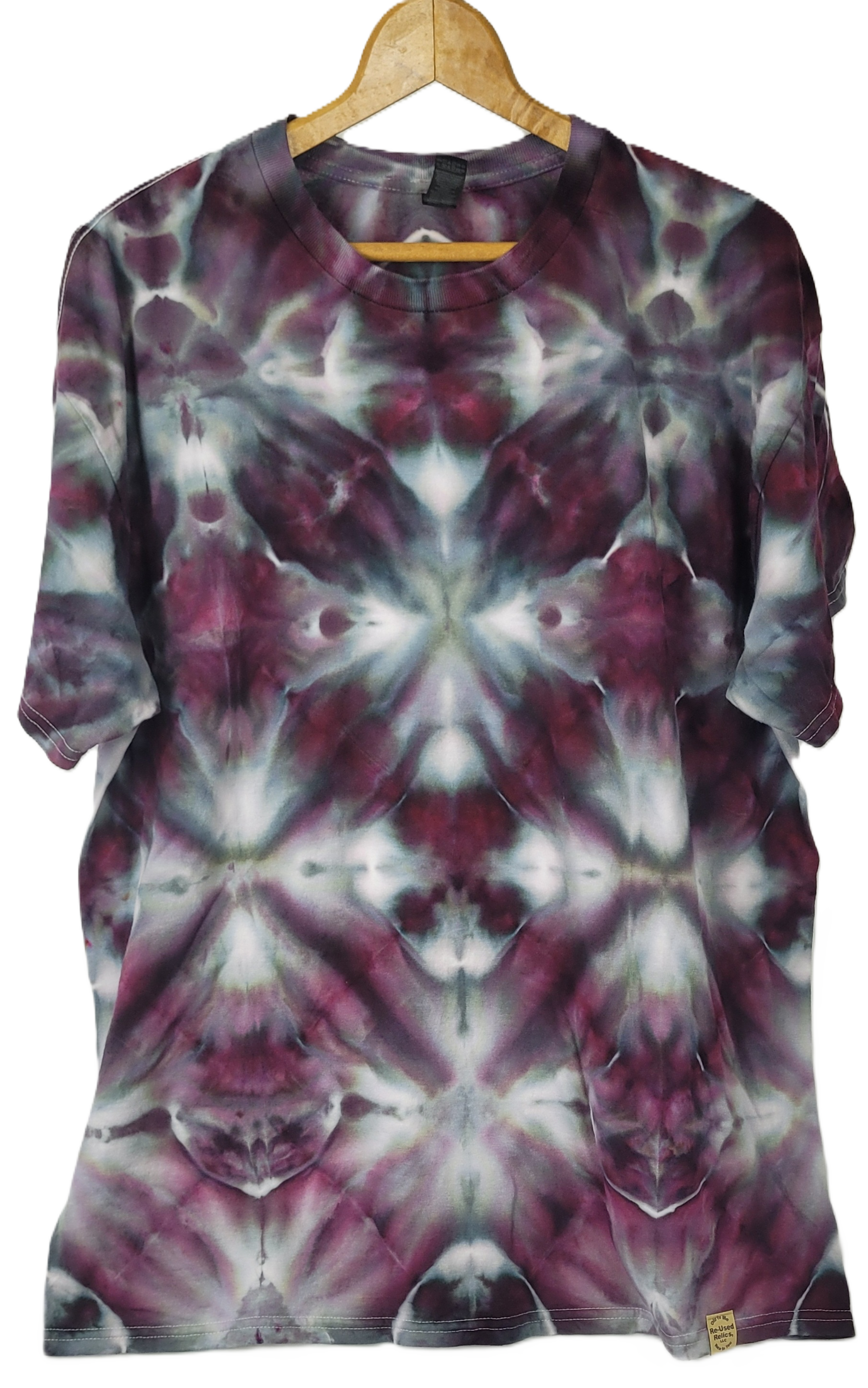 Tie-dye shirt on a hanger with a white background