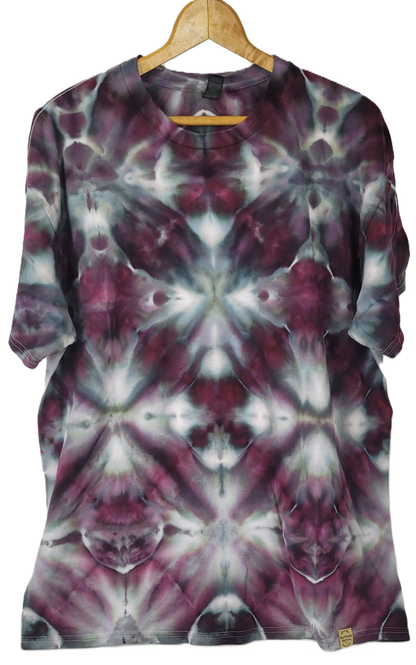 Tie-dye shirt on a hanger with a white background