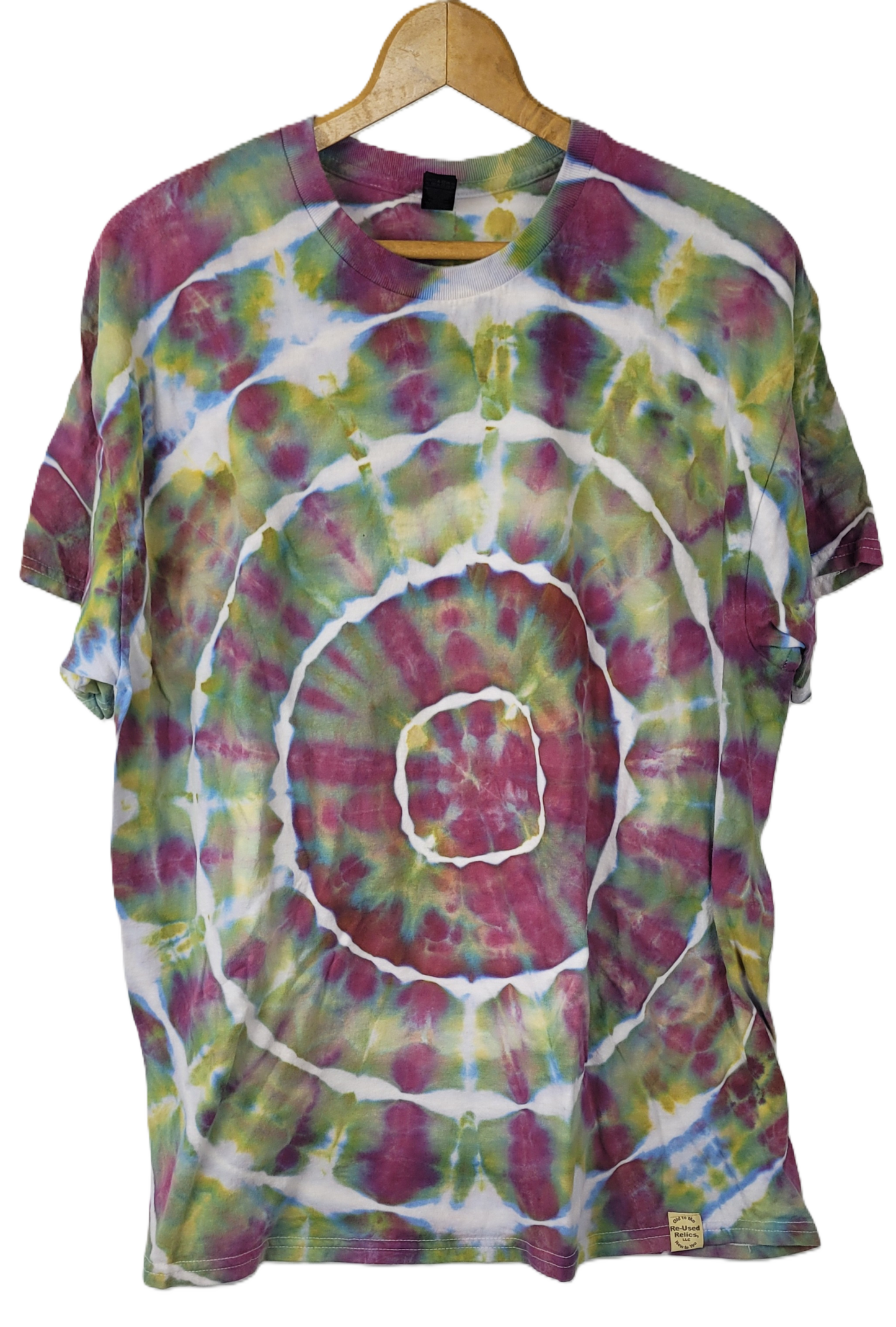 Tie-dye t-shirt with a spiral pattern on a hanger against a white background