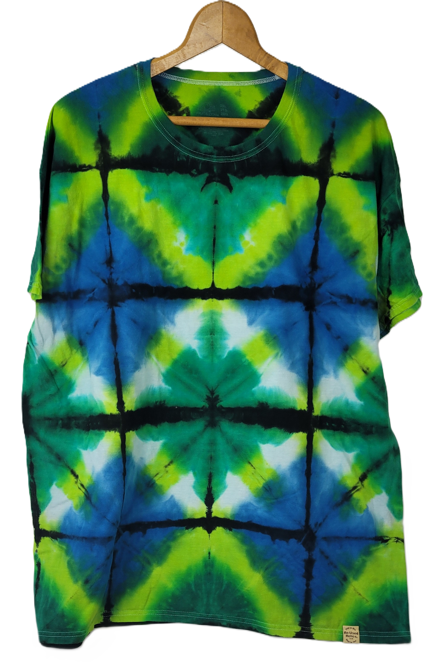 Tie-dye t-shirt with green, blue, and black pattern on a hanger