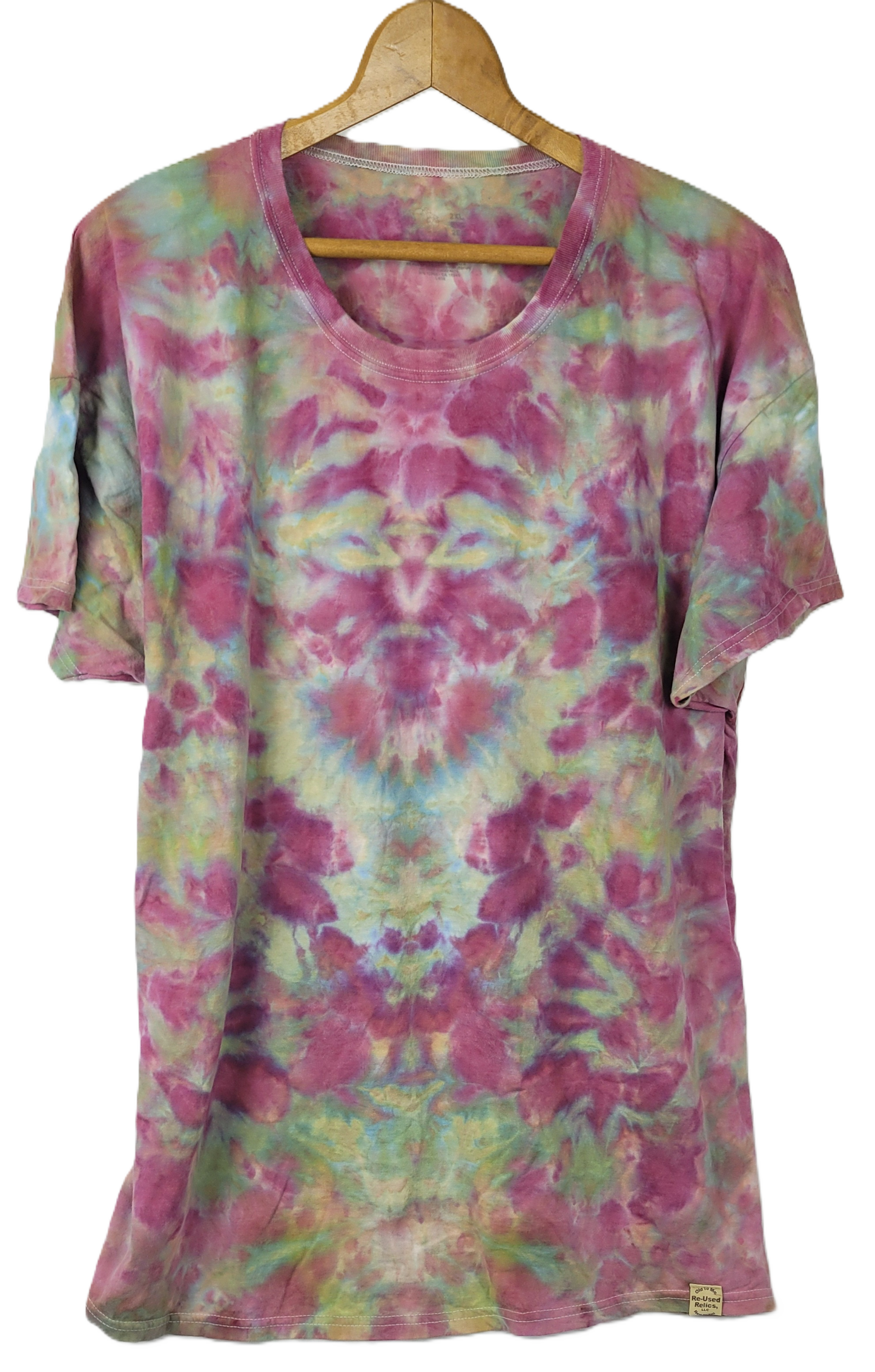 Tie-dye t-shirt on a hanger with a white background